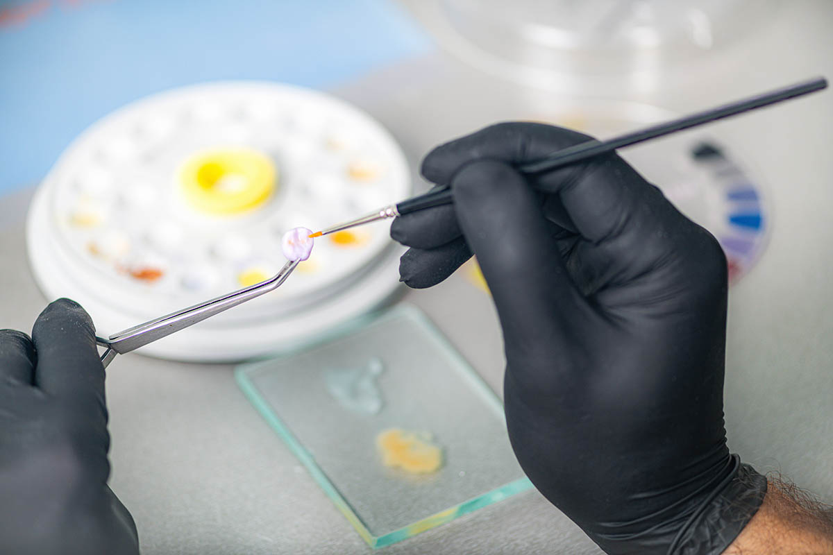 dental technician making a dental crown