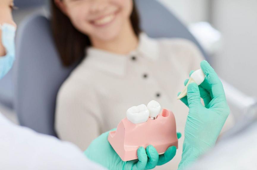 Dentist explaining tooth extraction Dentist explaining tooth extraction