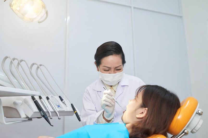 female dentist working with patient female dentist working with patient