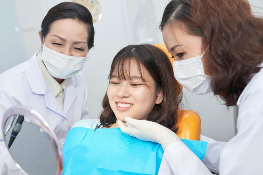 Smiling teenager checking healthy teeth Smiling teenager checking healthy teeth