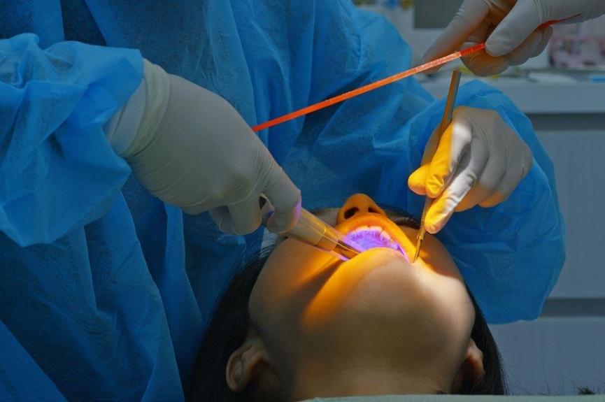 woman and dentist periodontal treatment