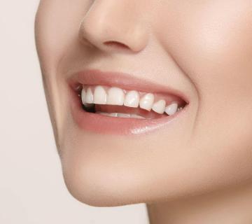 Beautiful and healthy woman smile