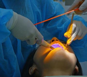woman and dentist periodontal treatment