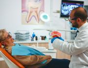 elderly woman at the dentist for dental implant elderly woman at the dentist for dental implant