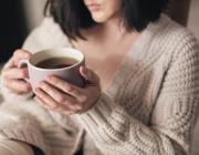 woman with invisalign aligners drinking tea woman with invisalign aligners drinking tea