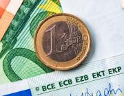 How much is dental implant in Singapore? currency banknotes and coins