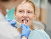 woman at the dentist for choosing dental crown woman at the dentist for choosing dental crown