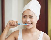 asian woman brushing teeth asian woman brushing teeth