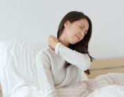 woman rubbing her shoulder to eliviate pain woman rubbing her shoulder to eliviate pain